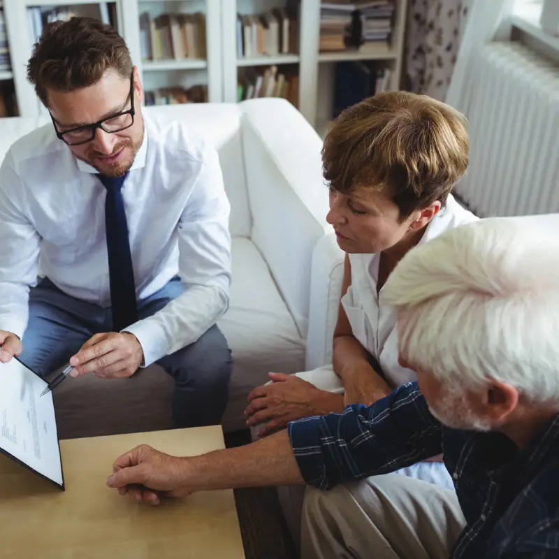 Supportive Ipswich property clearance worker speaking with family after bereavement.